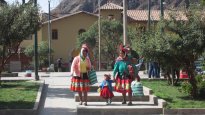 traditiionaly-dressed locals in Ollantaytambo square
