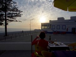 Enjoying a great glass of wine watching the sun set into the Atlantic Ocean