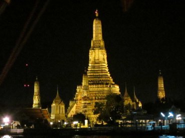 Illuminated temple along the river