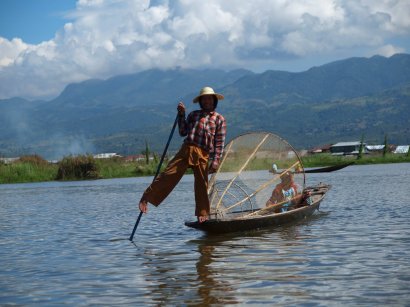 One-legged fisher - posing - with his unusual net